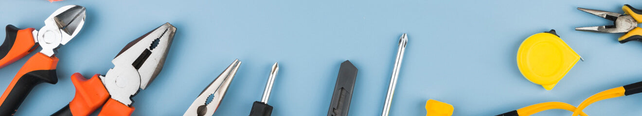 Electrician's tools laid out on a workbench